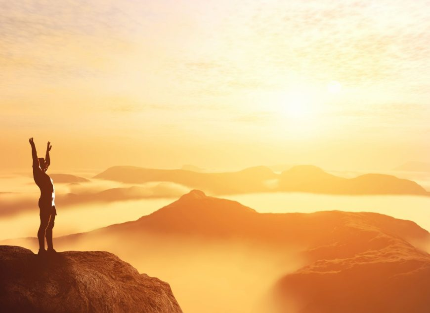 Man healthy and happy on mountaintop