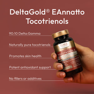 Hand holding a bottle of DeltaGold EAnnatto Tocotrienols with product details on a brown background Hover